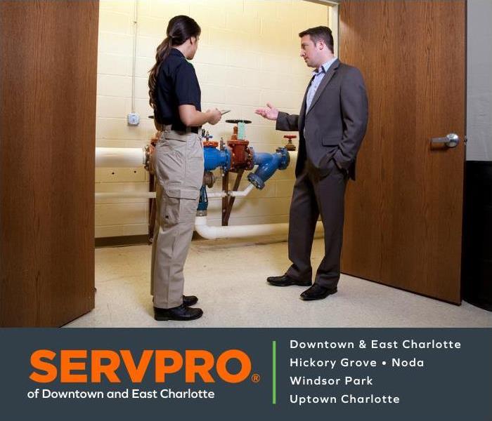 SERVPRO of Downtown and East Charlotte Sales Rep working with a business owner on their ERP